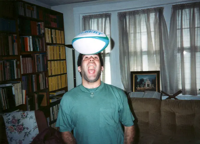 steve, with a rugby ball on his head