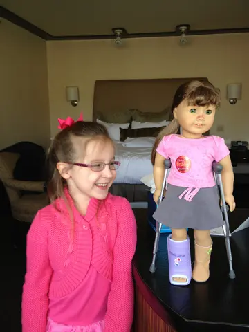 Martha admires her new doll