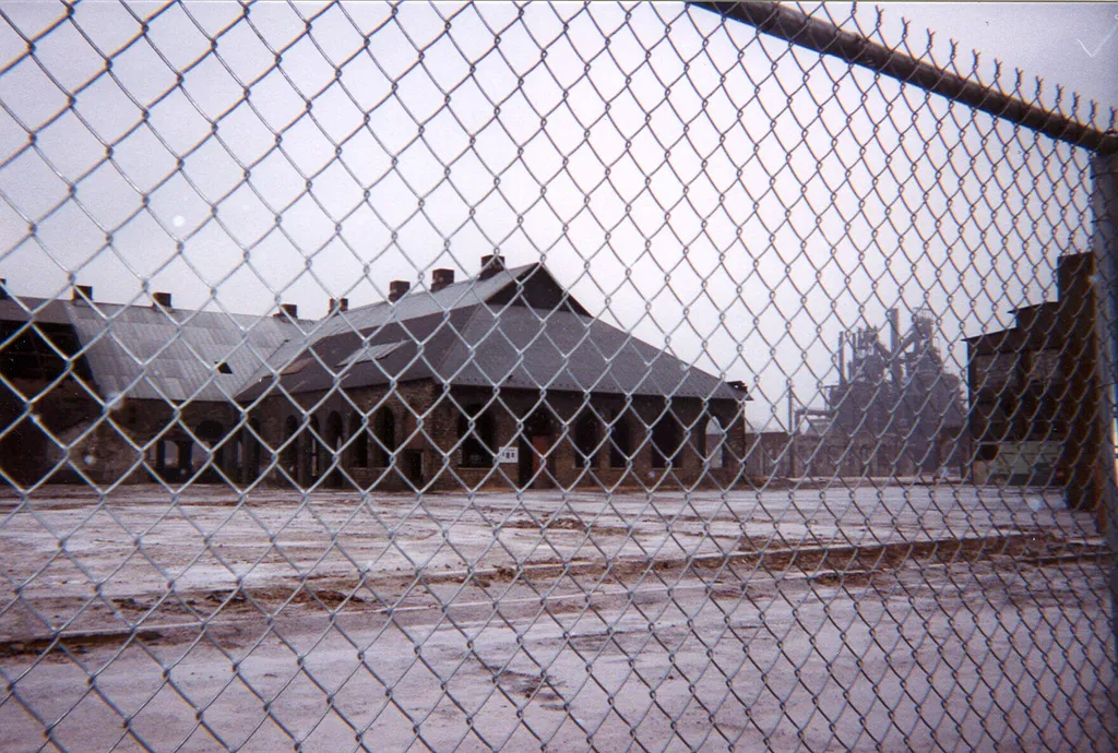 the steel, through a fence