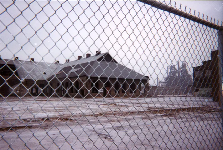 the steel, through a fence