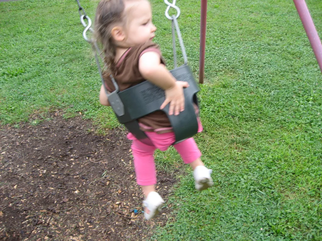 martha pushes herself on the swing